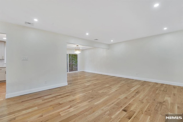 unfurnished room featuring light wood-type flooring