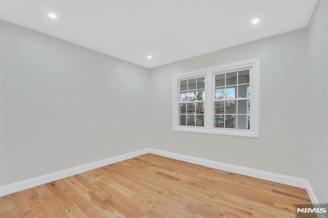 unfurnished room featuring light wood-type flooring