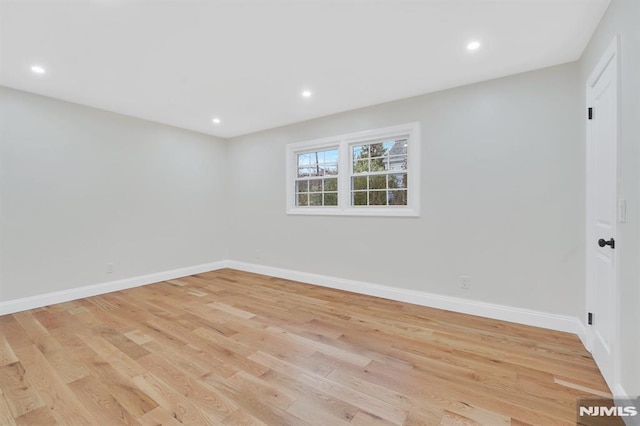 unfurnished room with light hardwood / wood-style floors