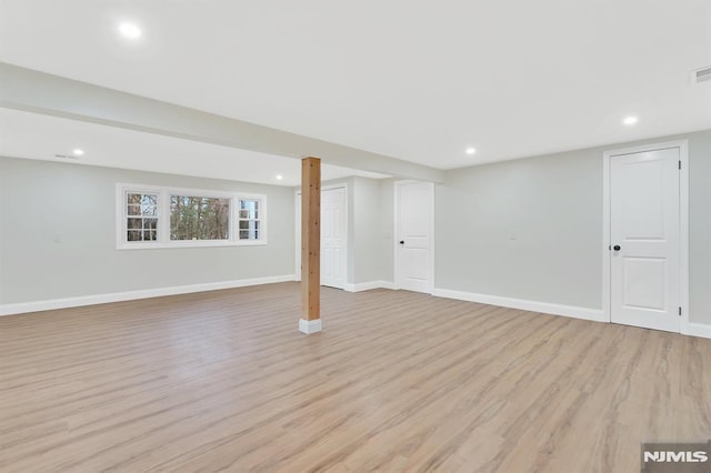 basement featuring light wood-type flooring