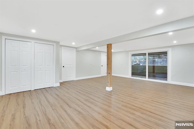 basement featuring light wood-type flooring