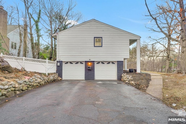 view of side of property featuring a garage