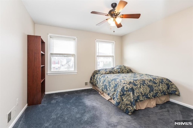 carpeted bedroom featuring ceiling fan