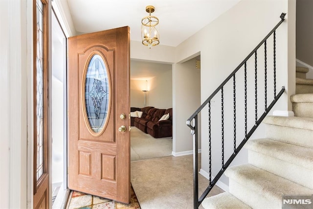 entrance foyer featuring an inviting chandelier