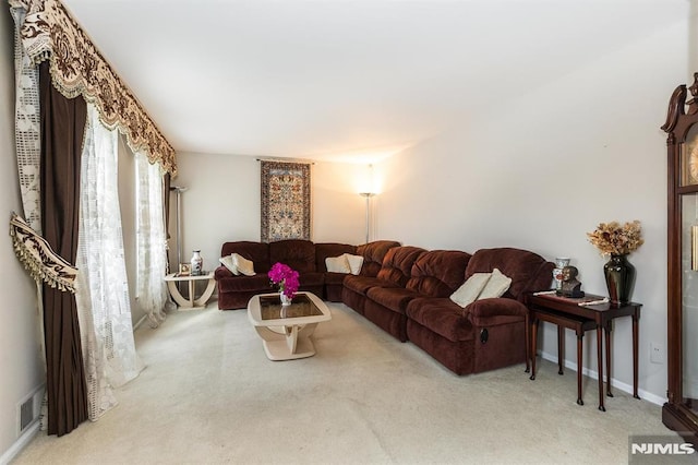 living room featuring light carpet