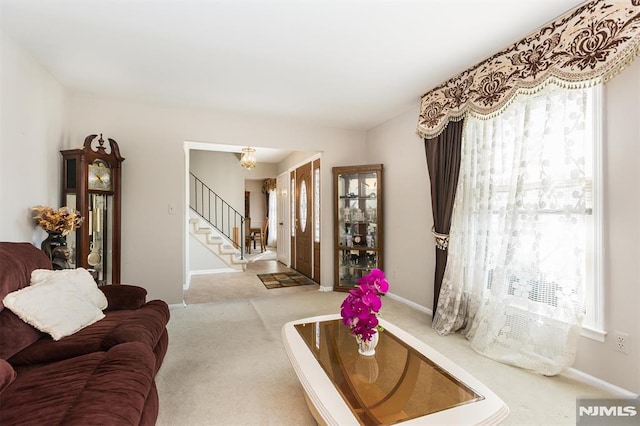 living room featuring light colored carpet