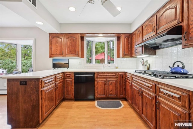 kitchen with sink, dishwasher, tasteful backsplash, kitchen peninsula, and stainless steel gas stovetop