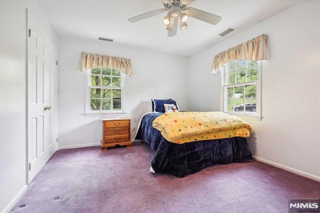 carpeted bedroom with ceiling fan