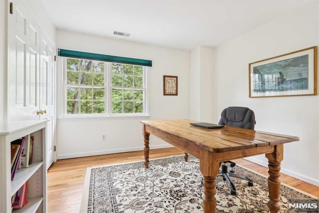 office space featuring light hardwood / wood-style floors