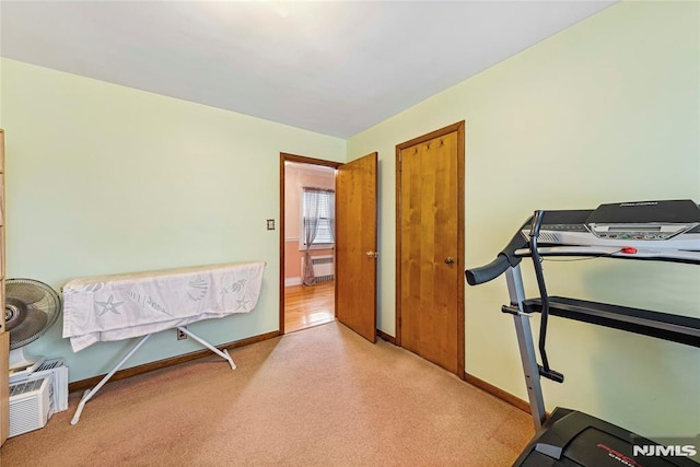 exercise room featuring radiator