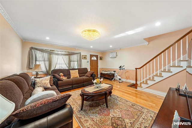 living room featuring crown molding and hardwood / wood-style flooring