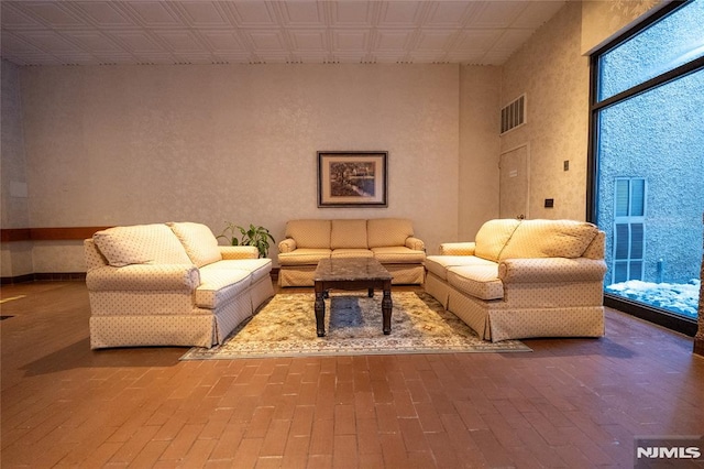 living room with a towering ceiling