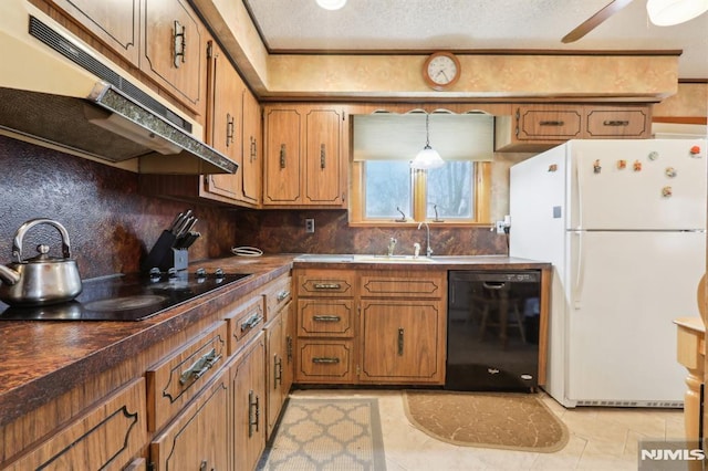 kitchen with backsplash, light tile patterned floors, black appliances, and hanging light fixtures