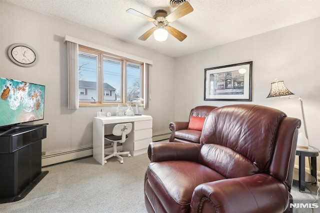 office featuring ceiling fan, light carpet, a baseboard radiator, and a textured ceiling