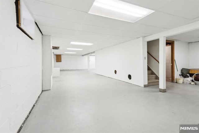 basement featuring a paneled ceiling