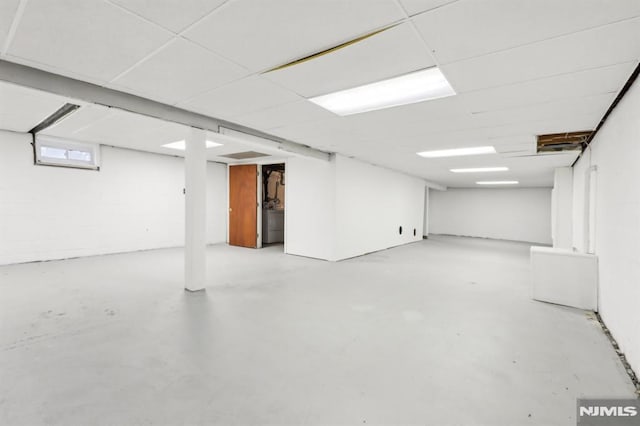 basement featuring a drop ceiling