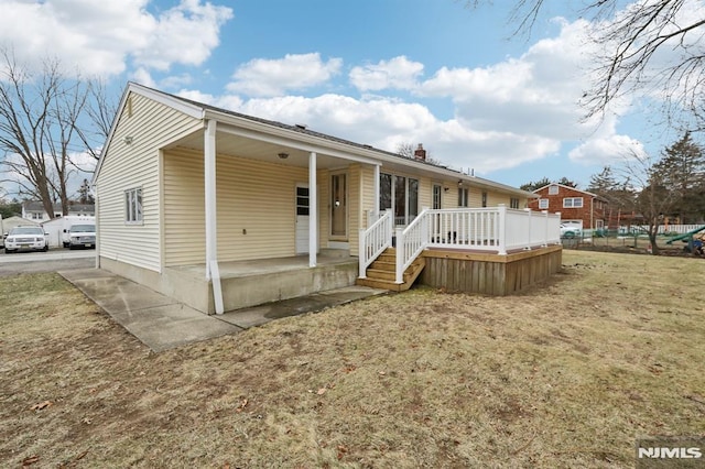 view of front facade with a porch and a front yard