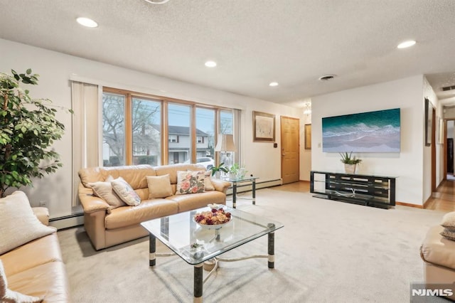 living room featuring a textured ceiling, light carpet, and a baseboard radiator