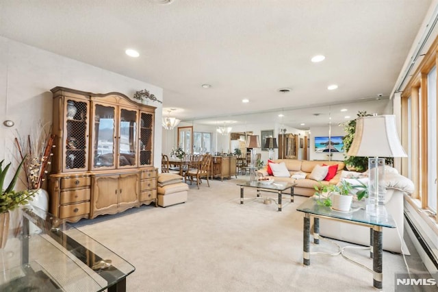 living room featuring a notable chandelier and light colored carpet