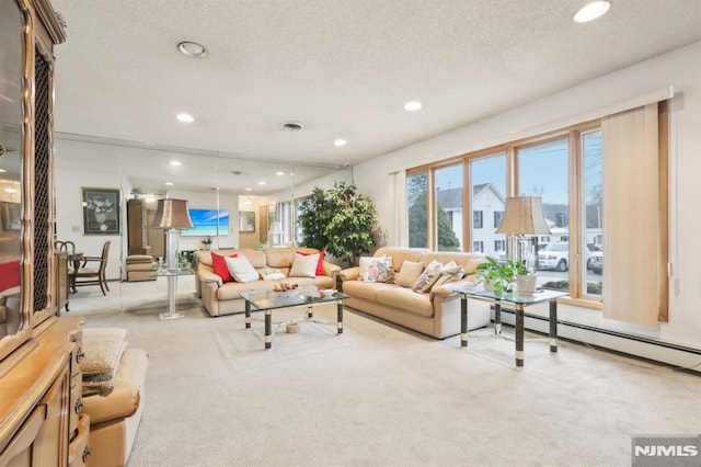 carpeted living room with a textured ceiling