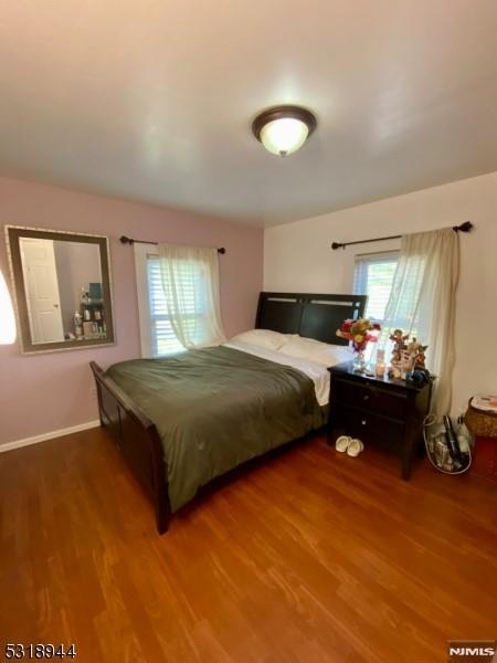 bedroom featuring wood-type flooring