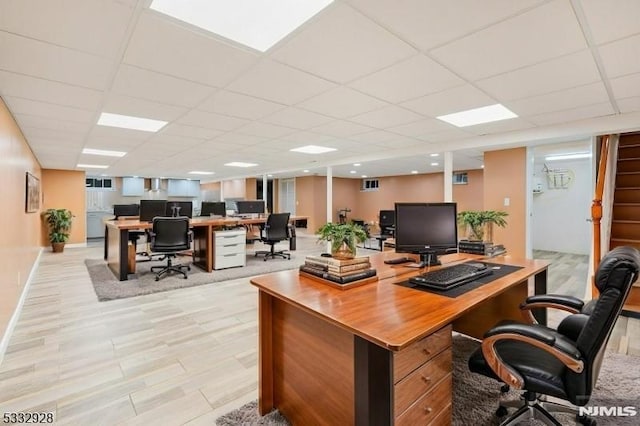 office space featuring a paneled ceiling