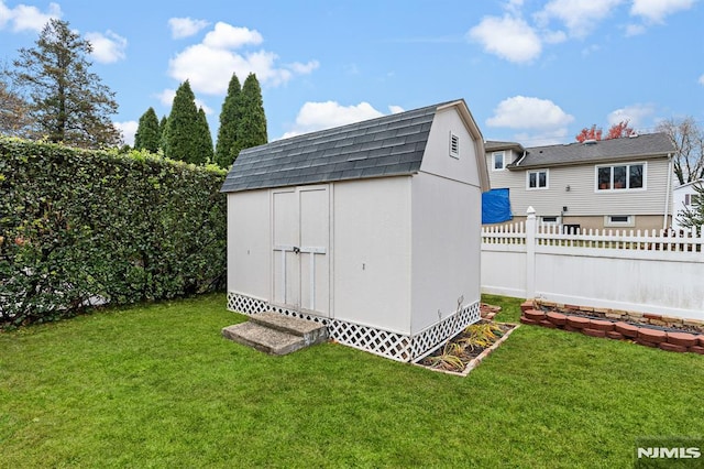 view of outdoor structure with a lawn