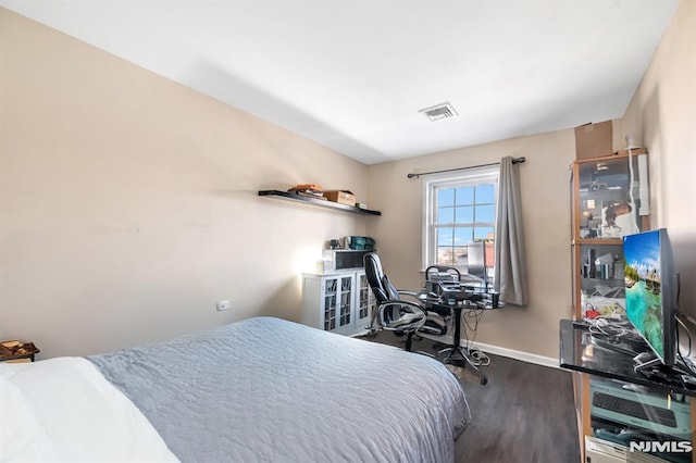 bedroom featuring hardwood / wood-style flooring