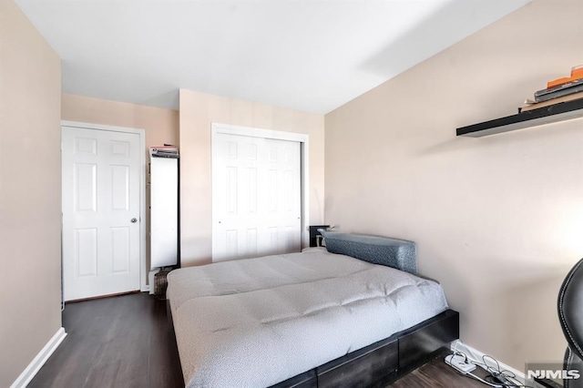 bedroom featuring dark hardwood / wood-style floors