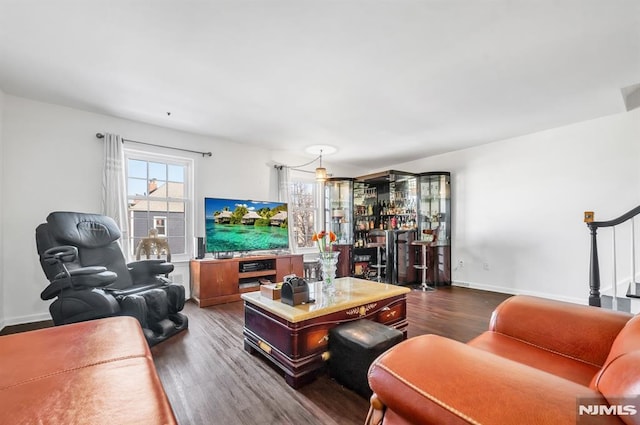 living room with dark hardwood / wood-style floors