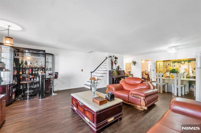 living room featuring dark wood-type flooring