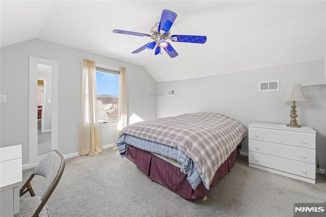 bedroom with ceiling fan, vaulted ceiling, and light colored carpet