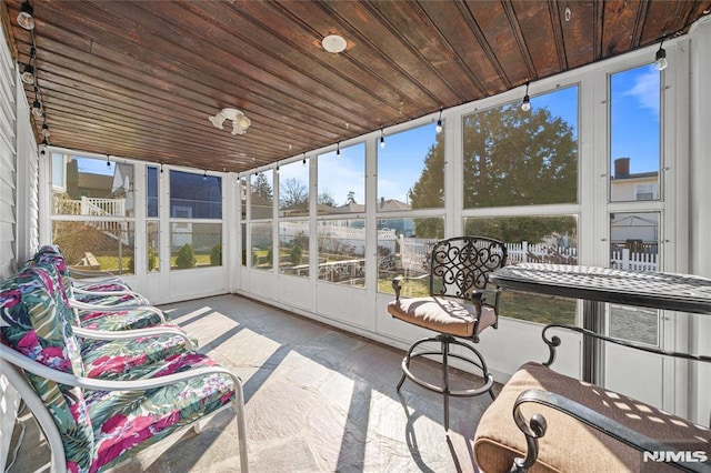 sunroom / solarium with wooden ceiling