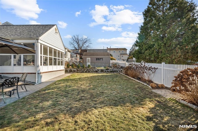 view of yard with a sunroom