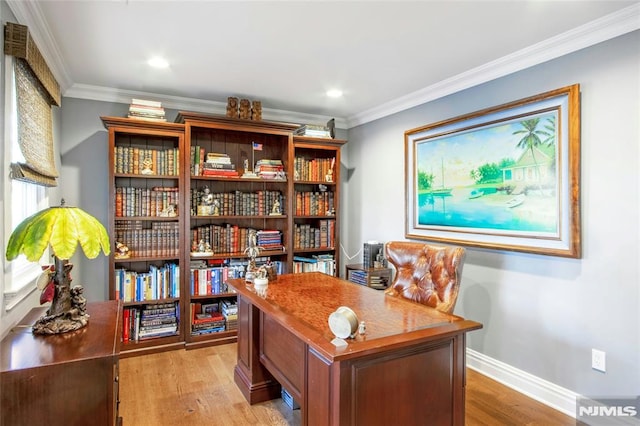 office area featuring light hardwood / wood-style floors and crown molding