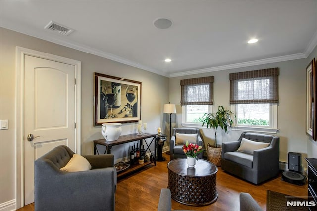 sitting room with dark hardwood / wood-style flooring and ornamental molding