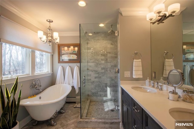 bathroom featuring parquet floors, vanity, ornamental molding, an inviting chandelier, and shower with separate bathtub