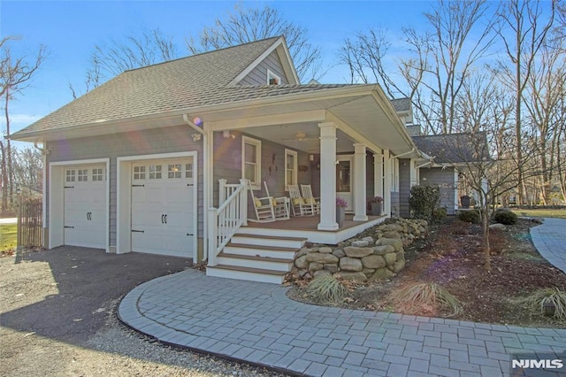 exterior space featuring a garage and covered porch