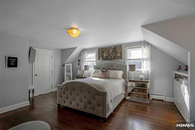 bedroom featuring baseboard heating, vaulted ceiling, and dark wood-type flooring