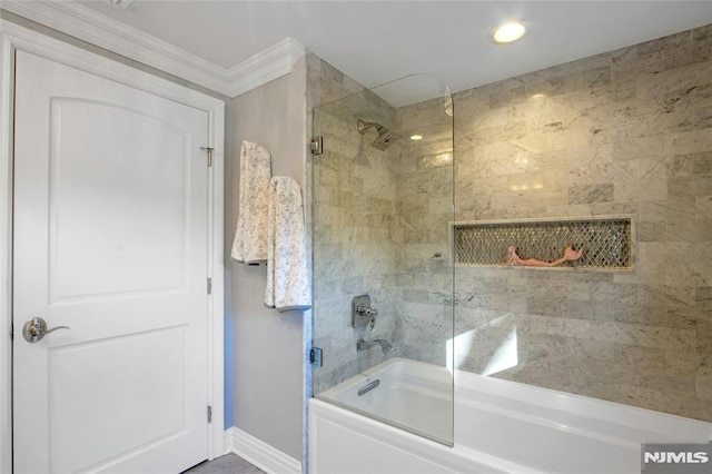 bathroom with enclosed tub / shower combo and ornamental molding