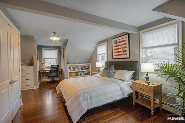 bedroom with dark hardwood / wood-style flooring and vaulted ceiling with beams