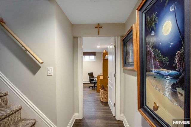 hall with dark wood-type flooring