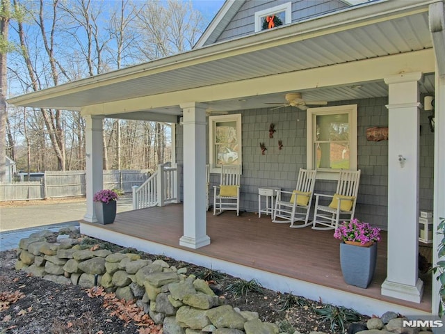 exterior space featuring covered porch and ceiling fan