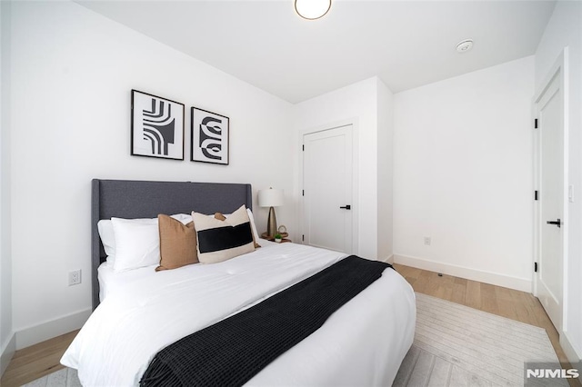 bedroom with light wood-type flooring