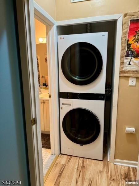 laundry area featuring stacked washer and dryer