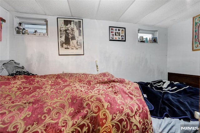 bedroom with a paneled ceiling