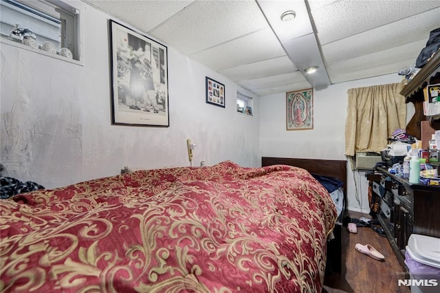 bedroom featuring a drop ceiling