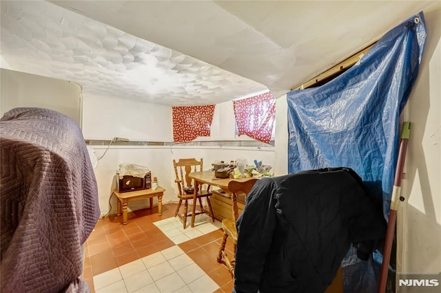 bedroom with tile patterned floors