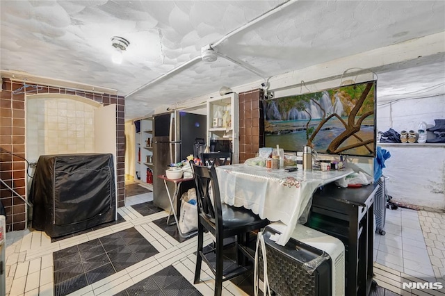 dining space featuring tile patterned floors