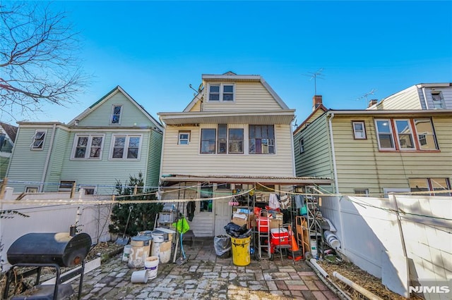 rear view of property with a patio area